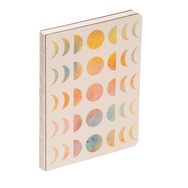 front of hardcover notebook with a slight texture, light tan background with colorful moon pases